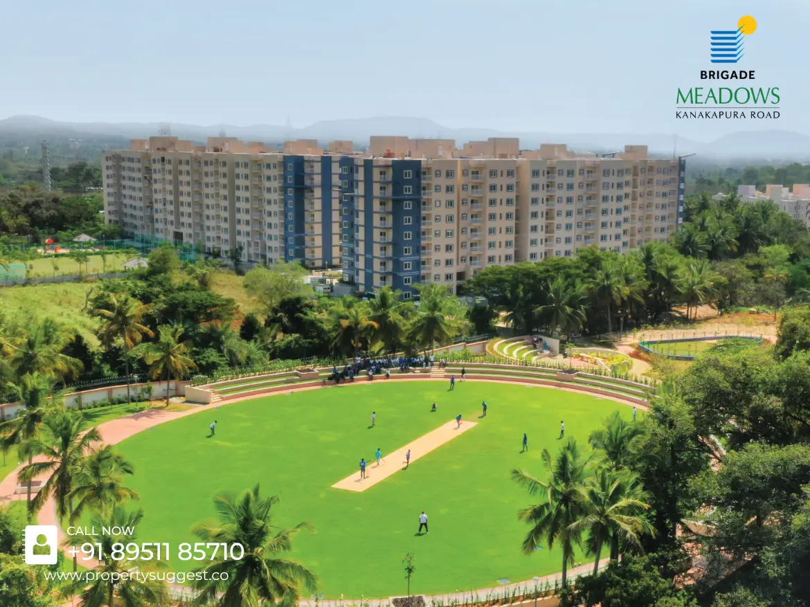 Aerial view of Azalea at Brigade Meadows residential towers in Kaggalipura, Uttarahalli Hobli, Kanakapura Road, Bangalore featuring low-rise apartments surrounded by greenery and a developed by Brigade Group.